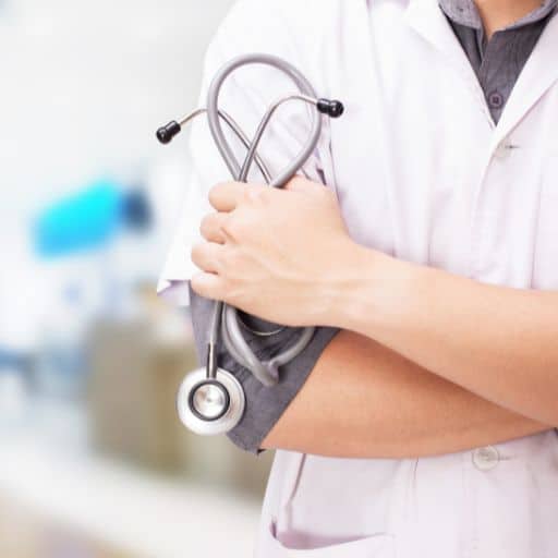a-man-in-a-white-shirt-holding-a-stethoscope